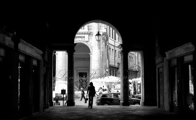 Girl in walkway Basilica Palladiana in Vicenza, Italy