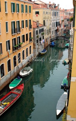 Boats in small canal in Venice, Italy 072 