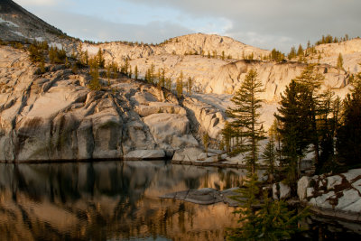 Early morning sunrise reflects off the smooth granite around Leprechaun Lake