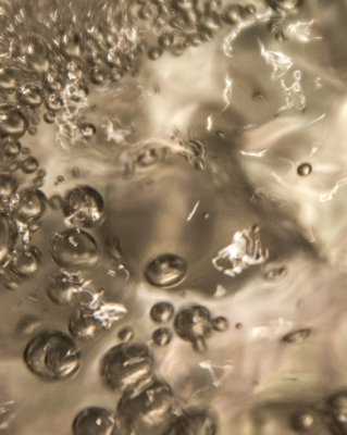 An old man's face in hot water