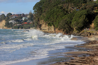 Splashing over the walkway under the cliff