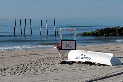 Newspaper Reader at 59th Street Pier