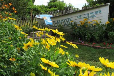 On the ocean side of the gardens are two lifeboats surrounded by flowers.
