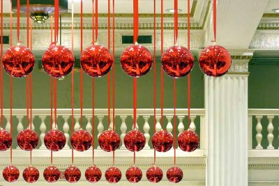 Christmas balls suspended from the ceiling in Macy's