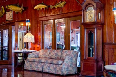 The dark wood panel rooms are part of the landmark Rod & Gun Club.