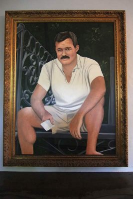 A portrait of Hemingway in the home.