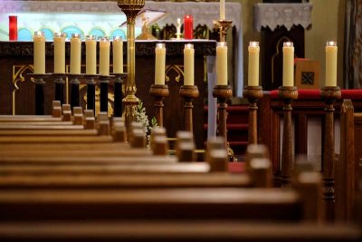 Pews and candles near the altar of St. Stanislaus Cathedral. 