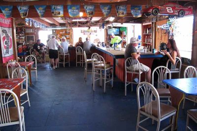 The second floor bar with windows opened to the deck for serving.