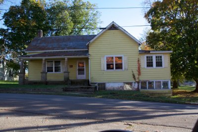 This house looks new till you realize the porch pillars are quarried stone