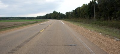 White junk on the roadside isn't litter, it's stray cotton.