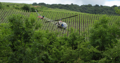 helicopter spraying grapes
