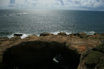 Devil's Punchbowl at Otter Rock (Zodiacs whale watching in the distance)