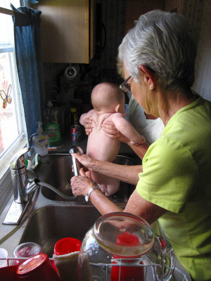 Great Grandma washing sandy butt
