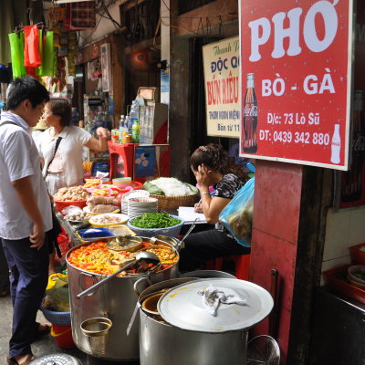 Hanoi street scene.  Pho Is Vietnam's wonderful gift to the world - Bo (beef) and Ga (chicken)