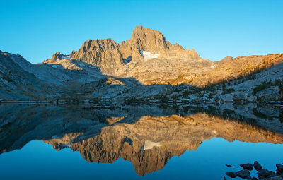 Early morning reflection of Banner and Ritter Peaks on Garnet Lake.