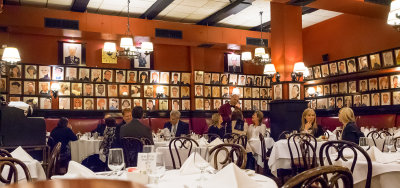 Sardi's Restaurant off Broadway.  There are hundreds if not thousands of caricatures of past and present stars lining the walls.