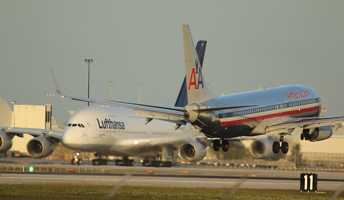 LH A-380 taxi for take off while AA 737 landed on MIA runway 9.