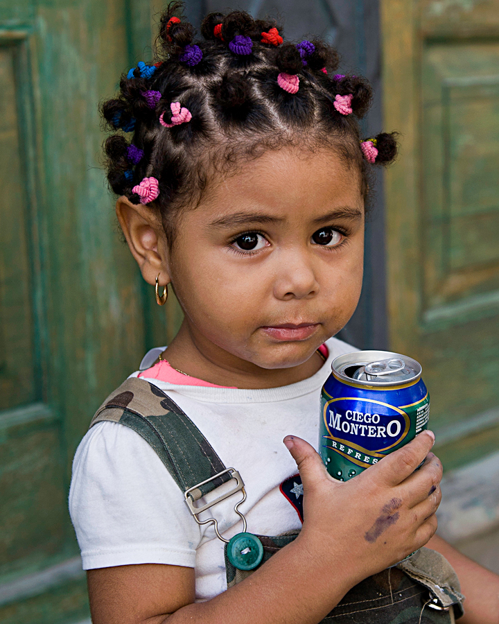 Little girl with a can of pop