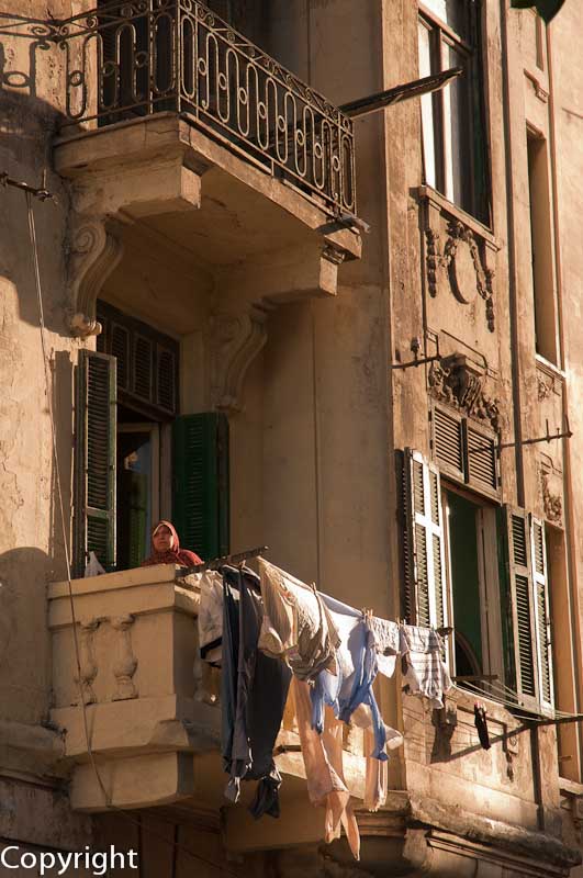 Woman hanging out the laundry