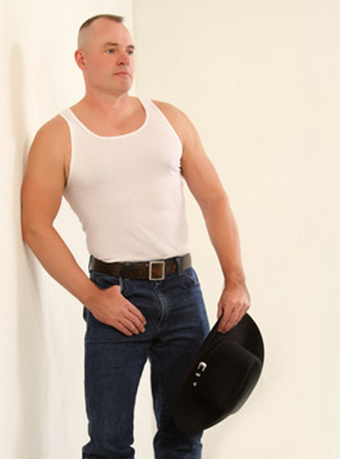 a ruggedly masculine handsome cowboy man tanktop.jpg