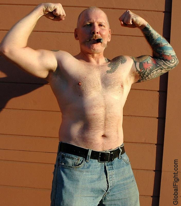 cigar pig leather daddy flexing double biceps big arms.jpg