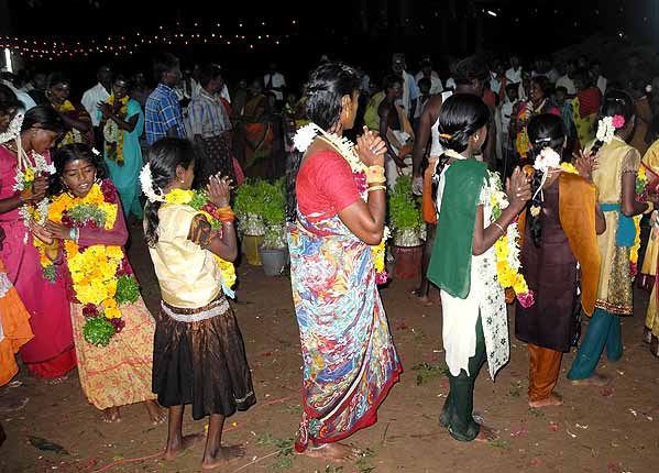 Finally the women dance in a circle around the Mulaipari pots. Mulaipari festival at Koovathupatti Tamil Nadu. 