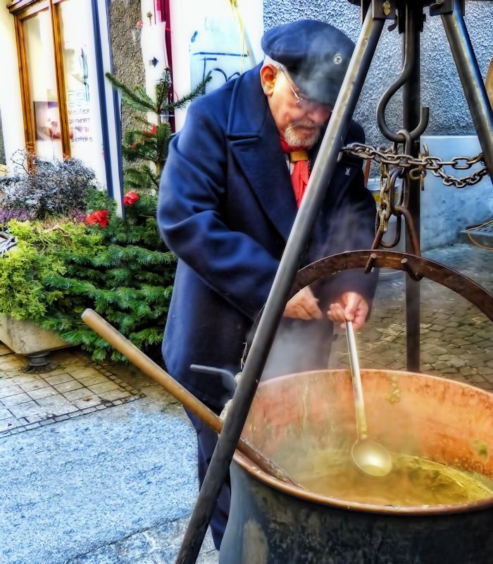 There is competition among the street vendors of hot soup...