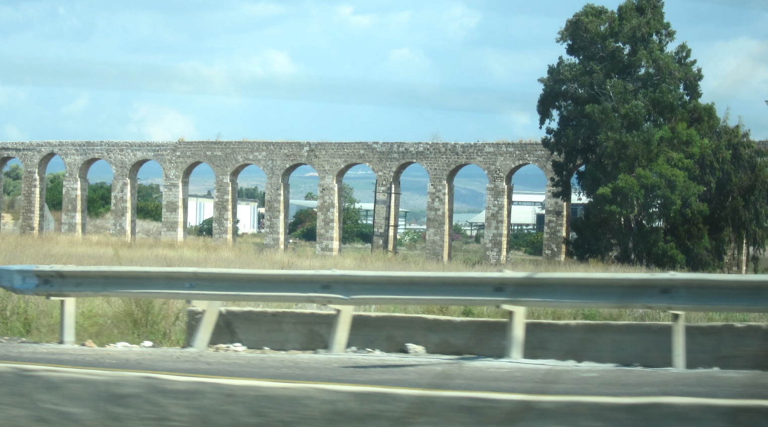 Roman aqueduct runs along the highway