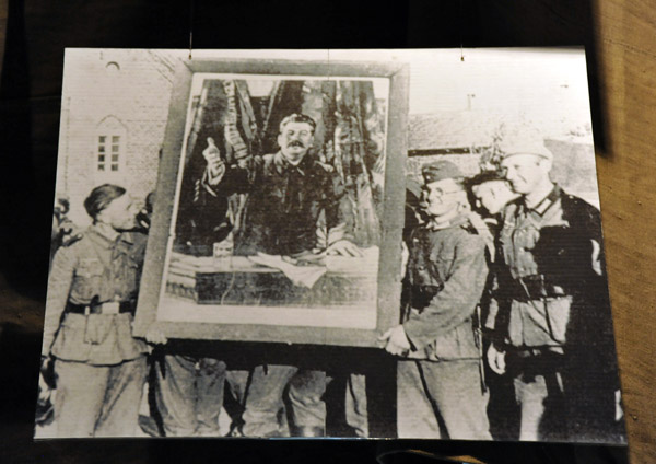 Historic Photograph - German soldiers with a captured portrait of Stalin