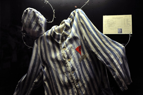 German Concentration Camp uniform with red triangle of a political prisoner with R for Russian