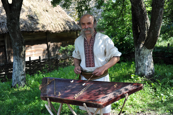 Ukrainian musician demonstrating a Tsymbaly (dulcimer), Pyrohiv