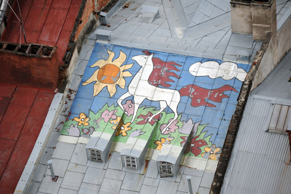 Mural of a horse on a hill with flowers on a sunny day, Rynok Square 27, Lviv