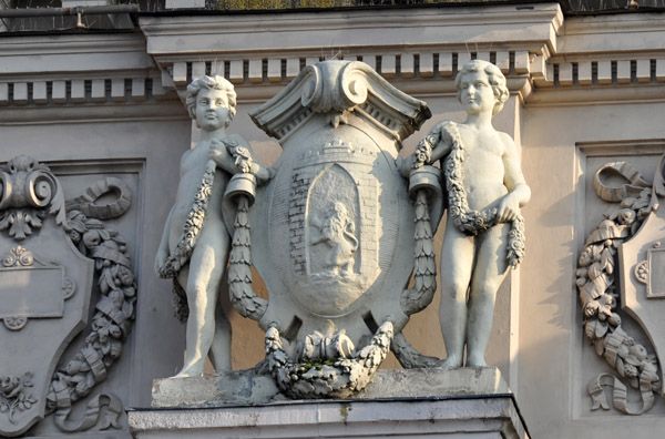 Coat of Arms of Lviv flanked by boys