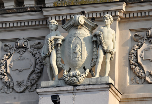 Coat of Arms of Lviv flanked by boys