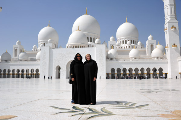Female visitors must dress appropriately to enter the Sheikh Zayed Mosque