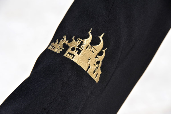 The mosque lends black abbayas with the image of the mosque in gold embroidery 