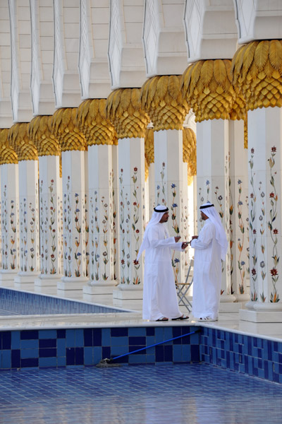 Emirati men traditionally dressed at the Sheikh Zayed Mosque