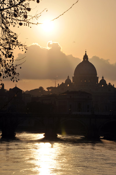 Sunset over the Tiber with the dome of St. Peter's