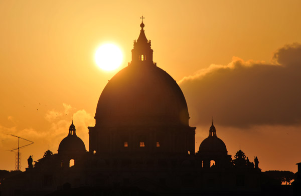 Silhouette of the dome of St. Peter's Basilica at sunset