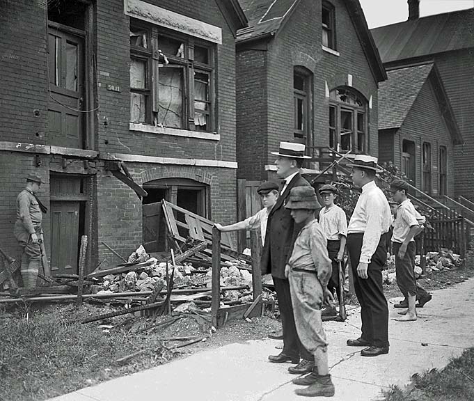1919 - Whites view destroyed homes of black residents after the riot