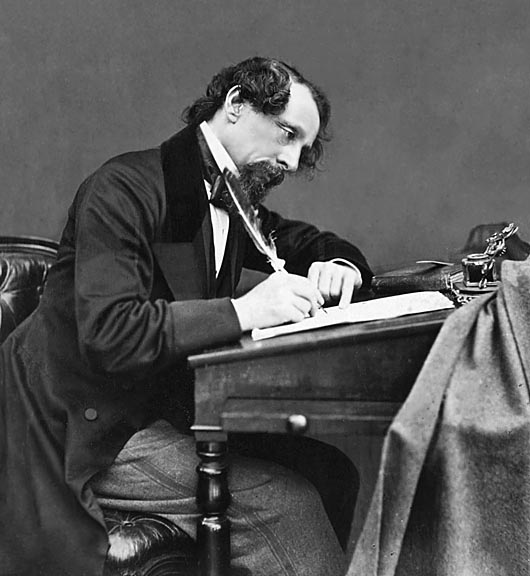 1858 - Charles Dickens at his desk