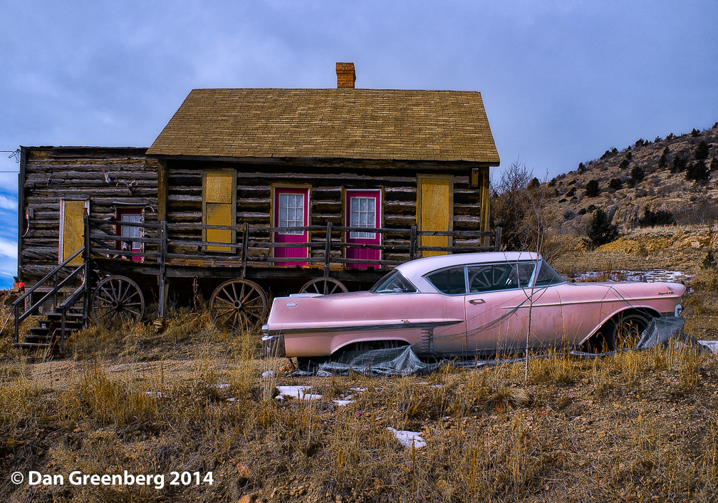 1957 Cadillac and Log Cabin