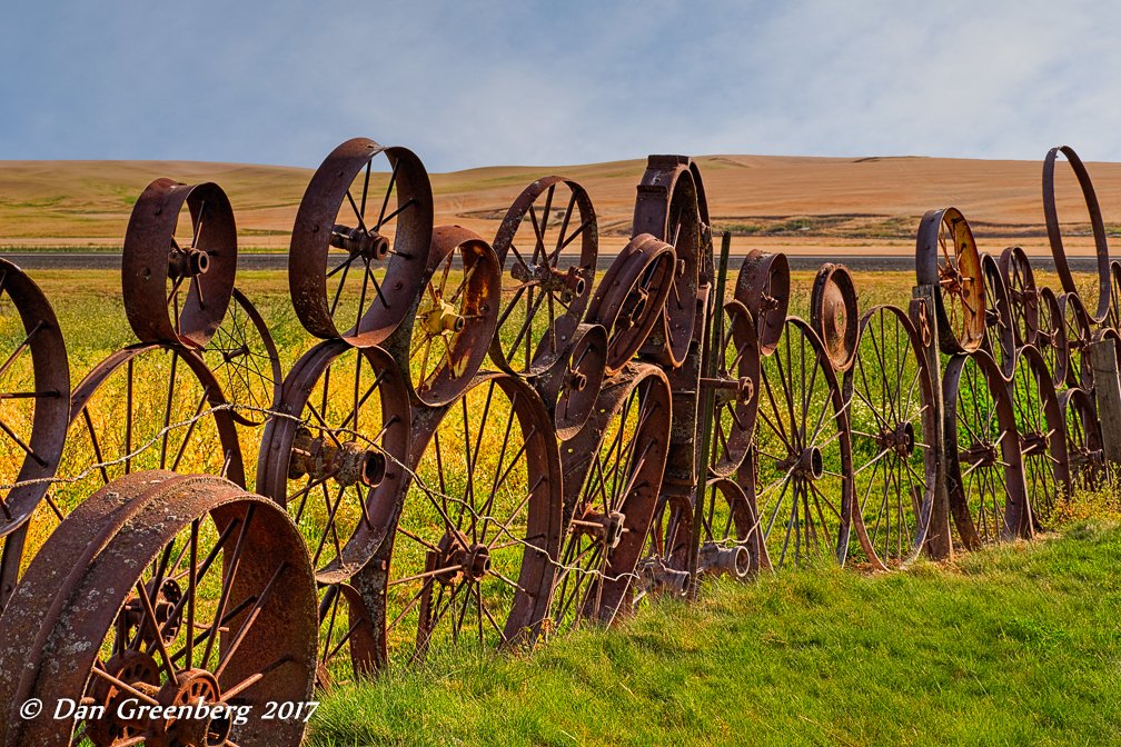 Fence of Antique Tractor Wheels