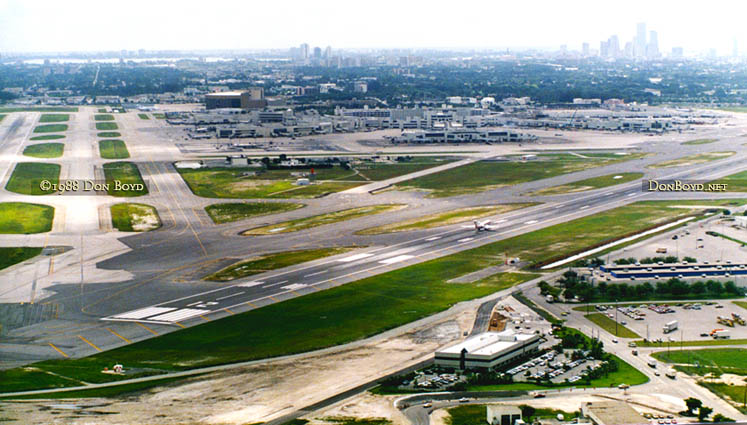 1988 - Boeing 727 taking off on runway 12 at Miami International Airport viewed from the west