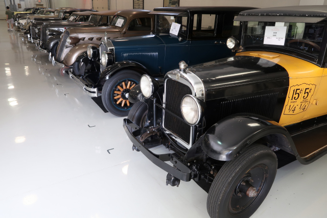 1930 GMC Model Six Yellow Taxi Cab, used in the 1946 James Stewart movie Its a Wonderful Life, next to a 1927 Buick (1099)