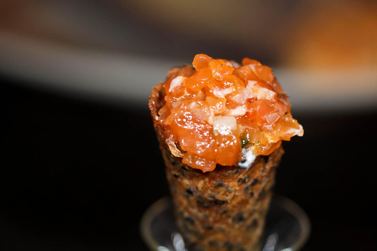 Salmon tartare and creme fraiche in black sesame seed tuile cornet