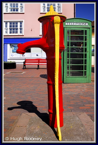  Ireland - Co.Cork - Kinsale - Colourful old pump and telephone box. 