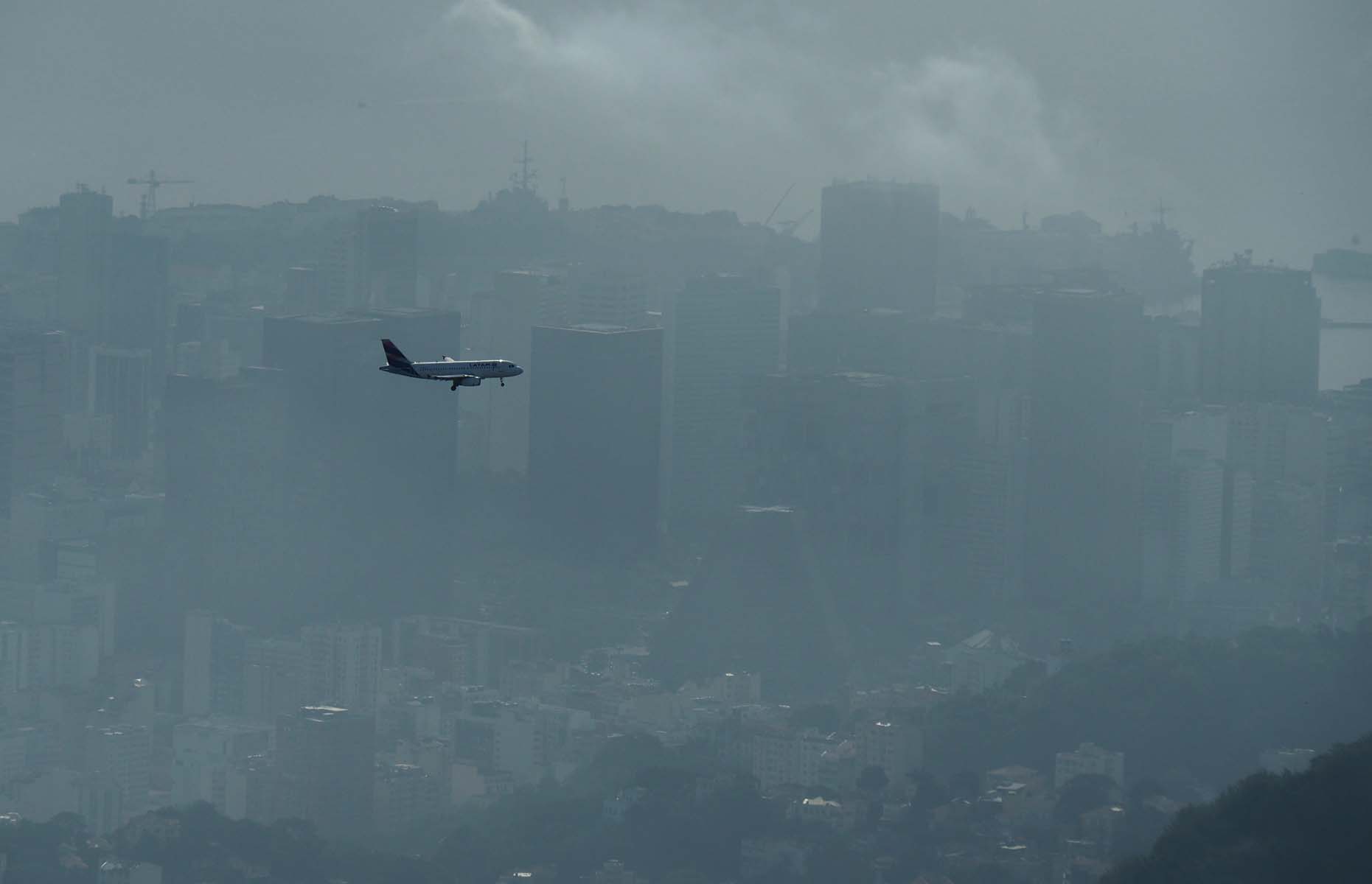 Seen from the Corcovado: airplane landing in Santos Dumont airport.
