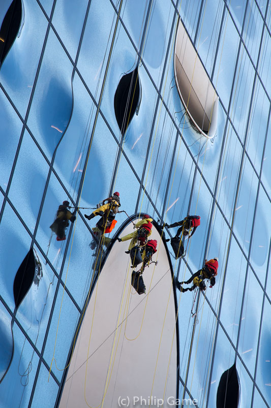 Window cleaners at work on the Elbphilharmonie concert hall