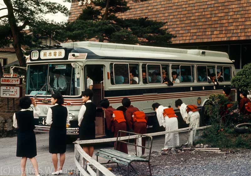 Hotel staff bow to departing guests